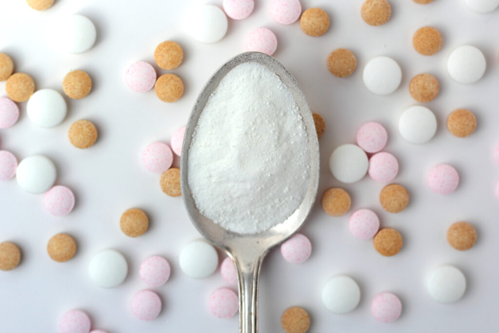 Photo of a teaspoon of sugar and pills