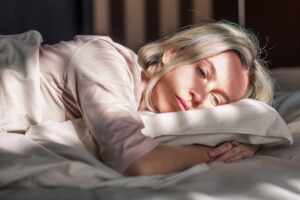 Photo of woman in bed looking exhausted